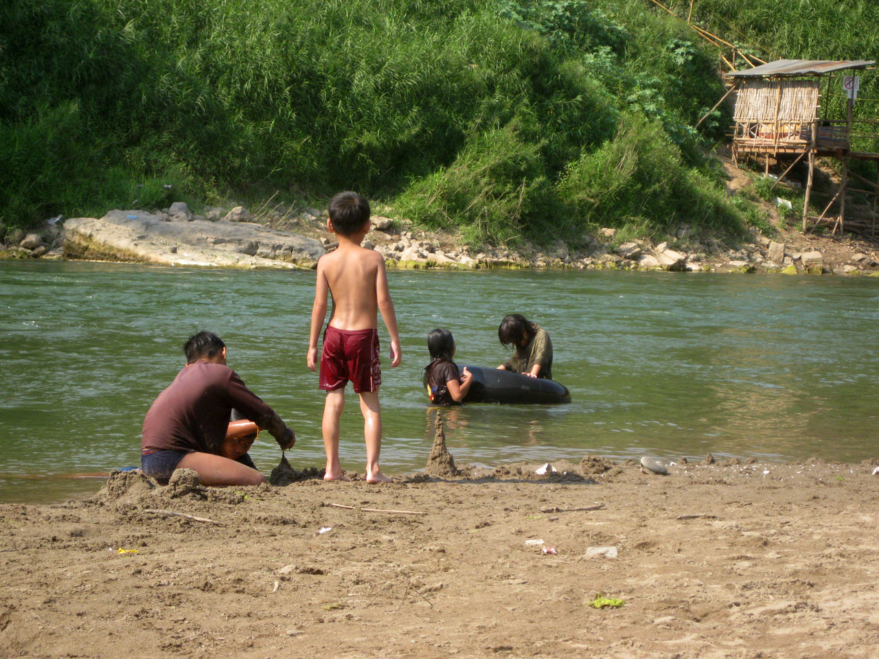 Lao kids building sand stupas, Luang Prabang, Laos