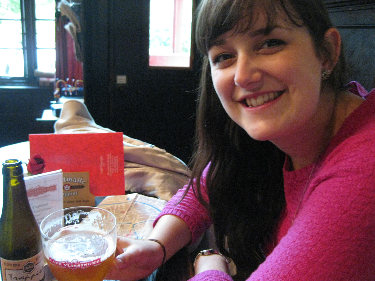 Polly sampling a Trappist beer at Café Vlissingghe, Bruges, Belgium