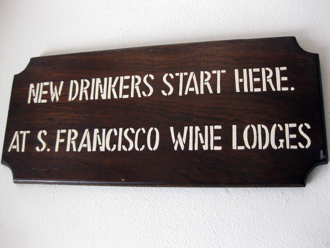 Sign reads 'New drinkers start here, at San Francisco Wine Lodges'