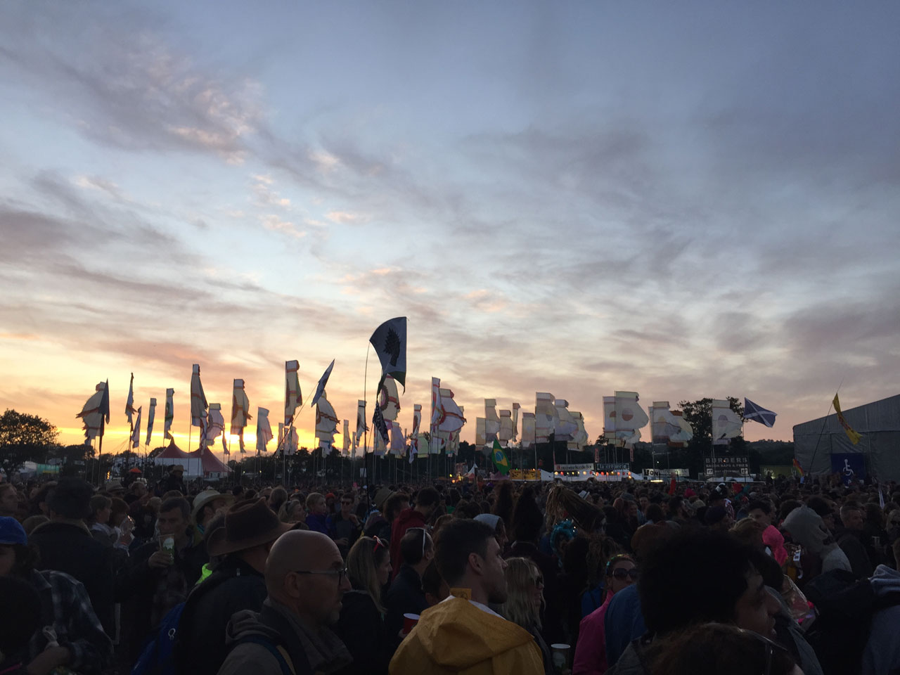 The sun sets over the West Holts field at Glastonbury 2015